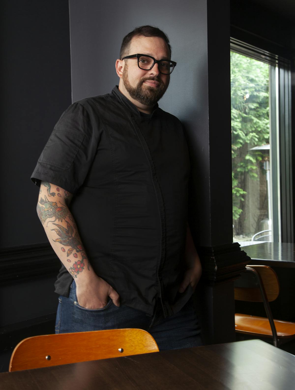 a man standing in front of a window