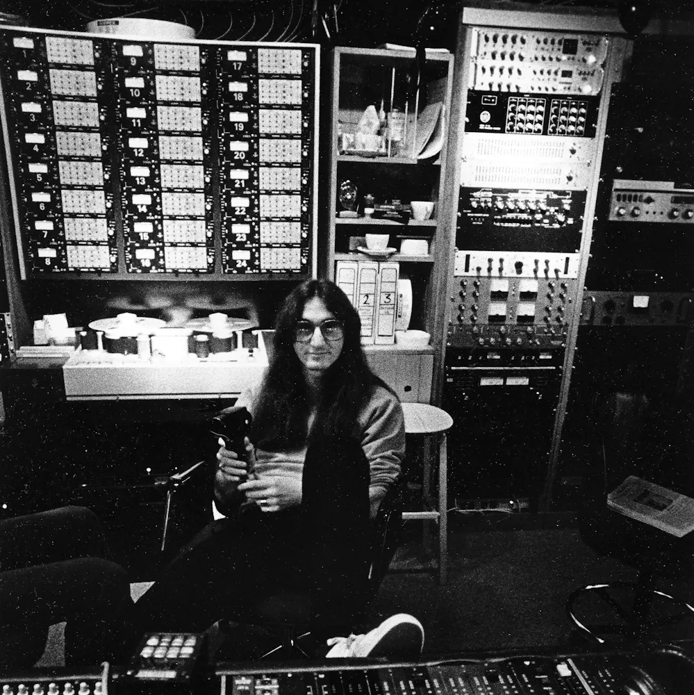 Lenny Kravitz sitting on a bench