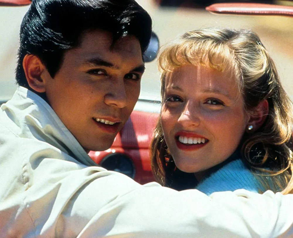 Jon Bon Jovi and woman posing for a picture