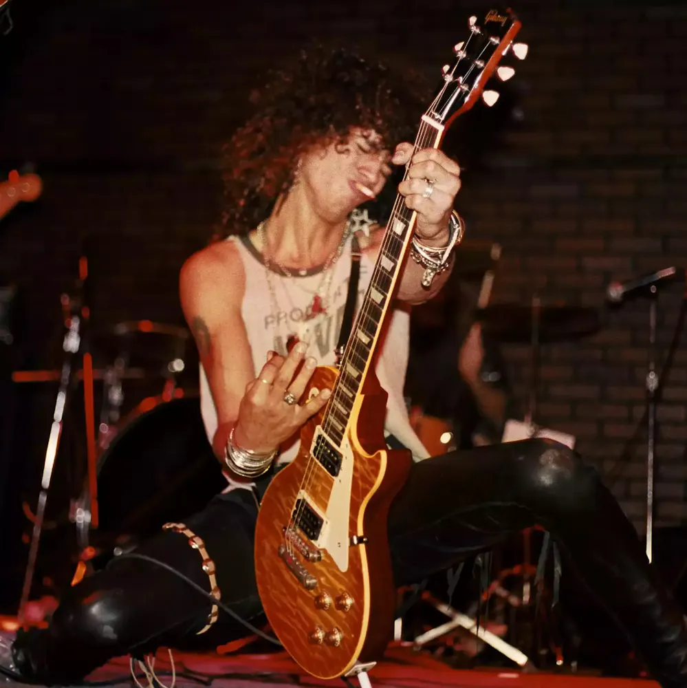 a close up of Klaus Meine wearing a hat