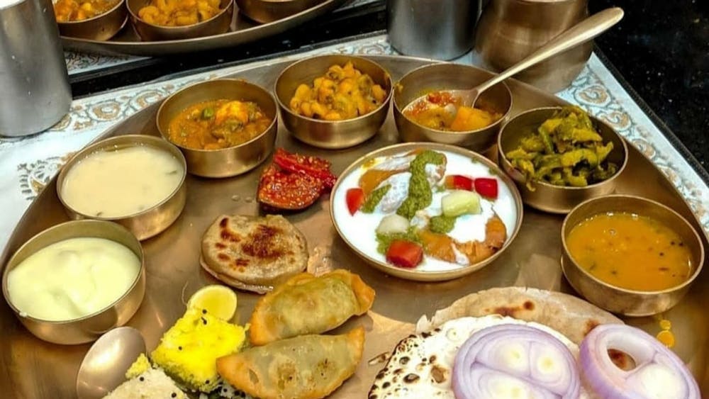 a bowl filled with many different types of food on a table