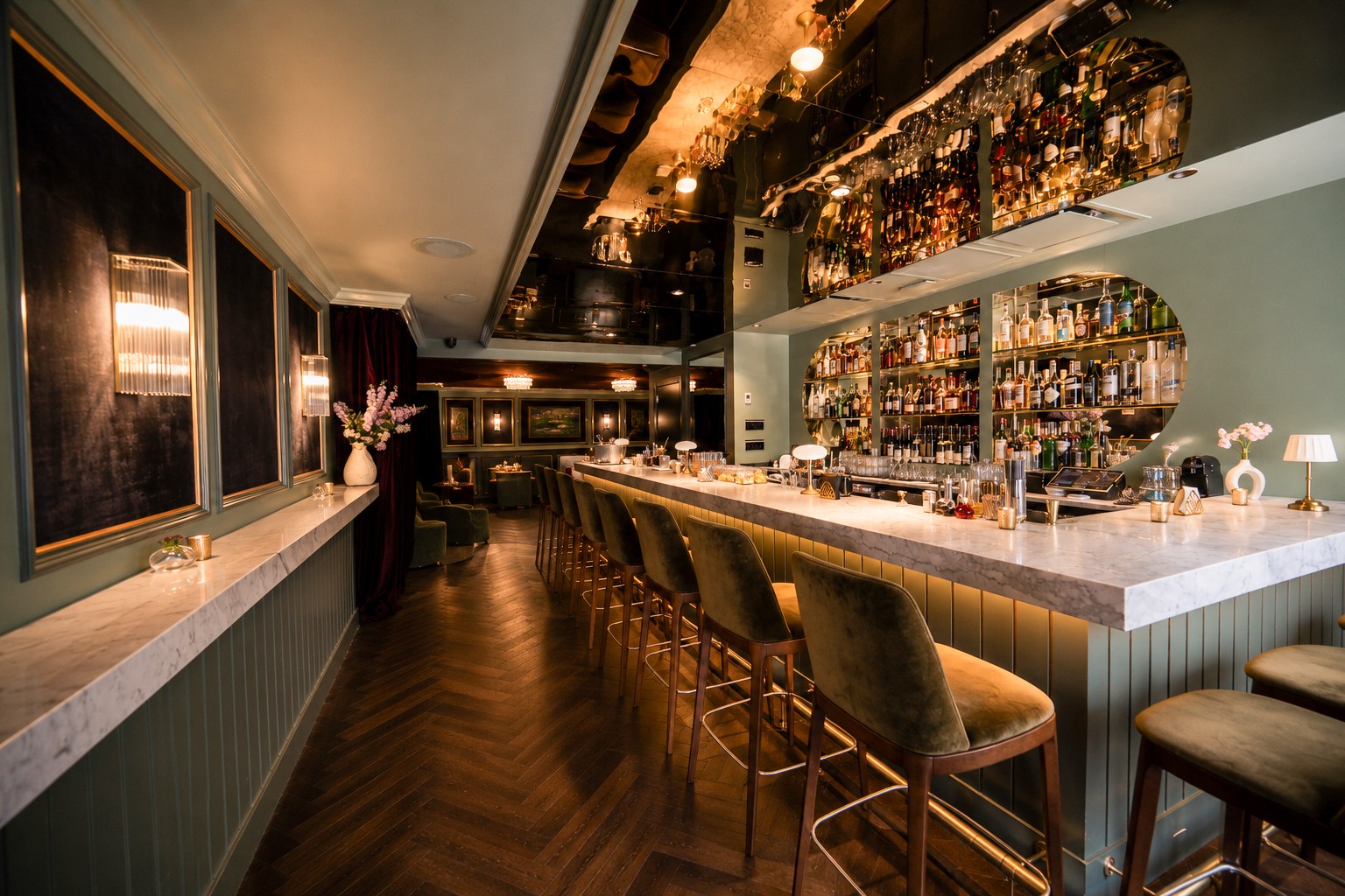 Alternate view of The Bar at Maison Madison showing refined interior details and lounge seating