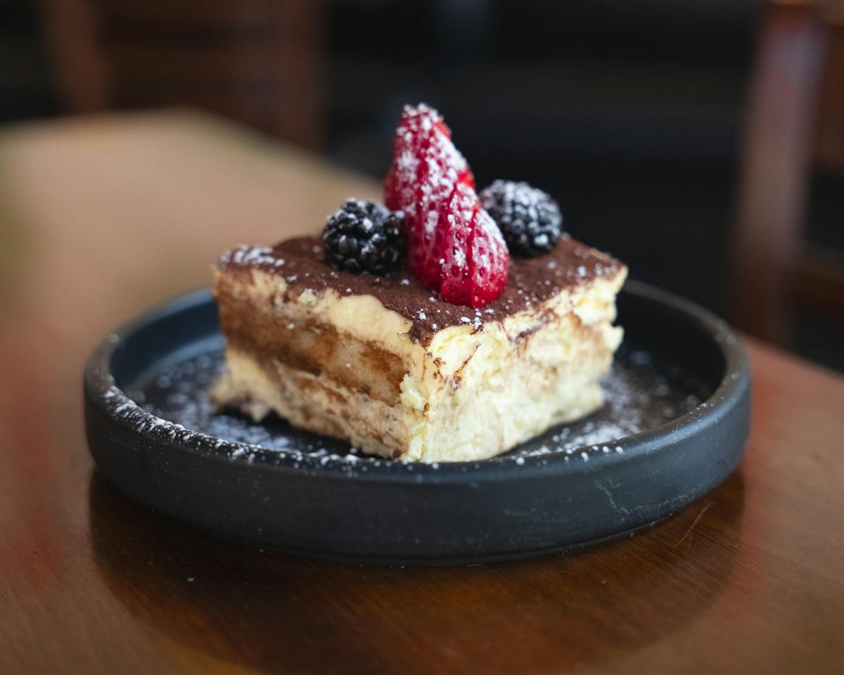 a piece of cake sitting on top of a wooden table