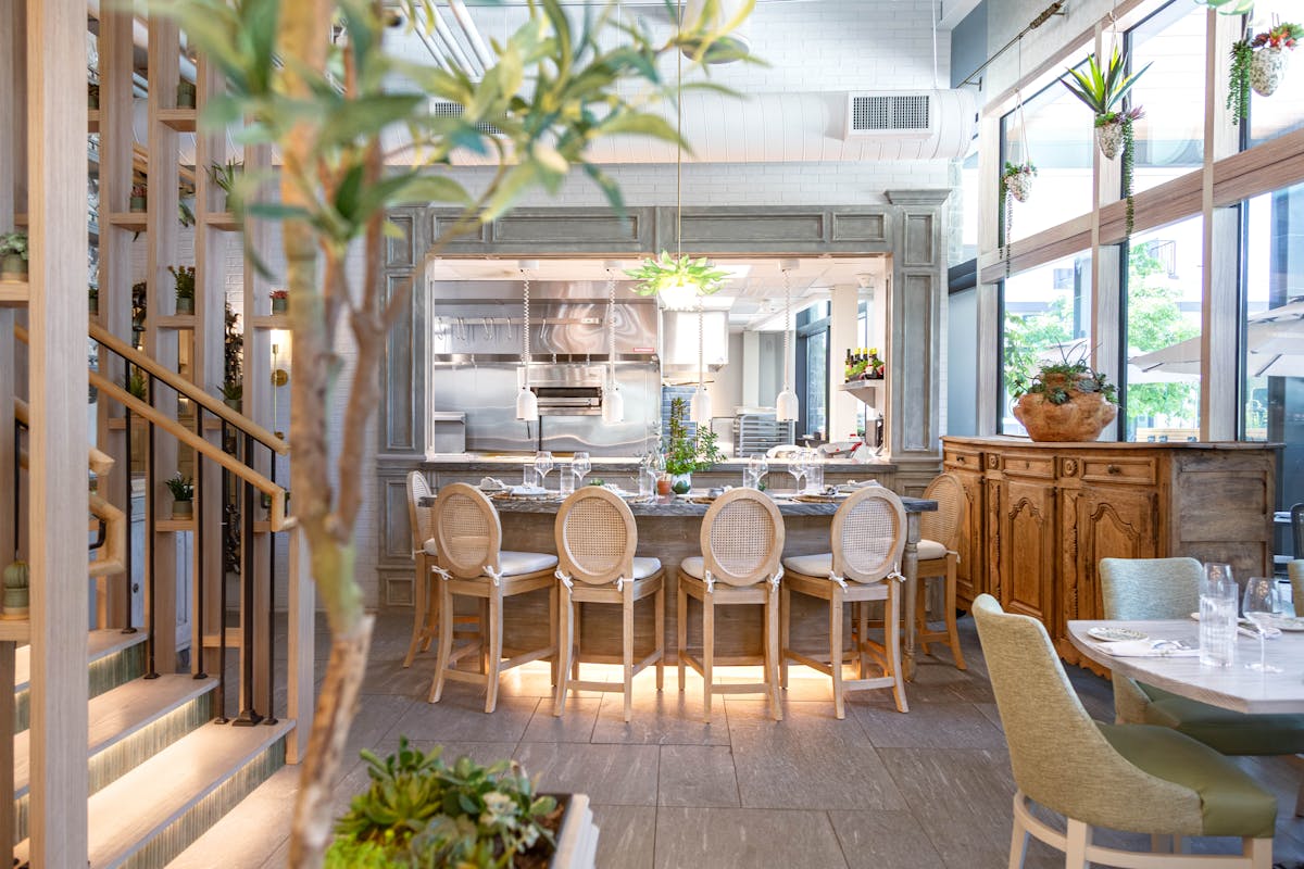 a dining room table in front of a window