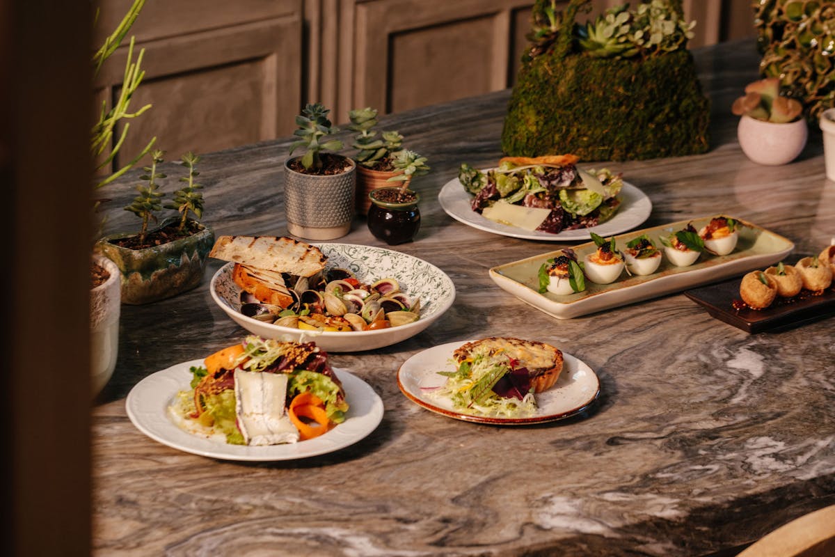 a table topped with plates of food on a plate