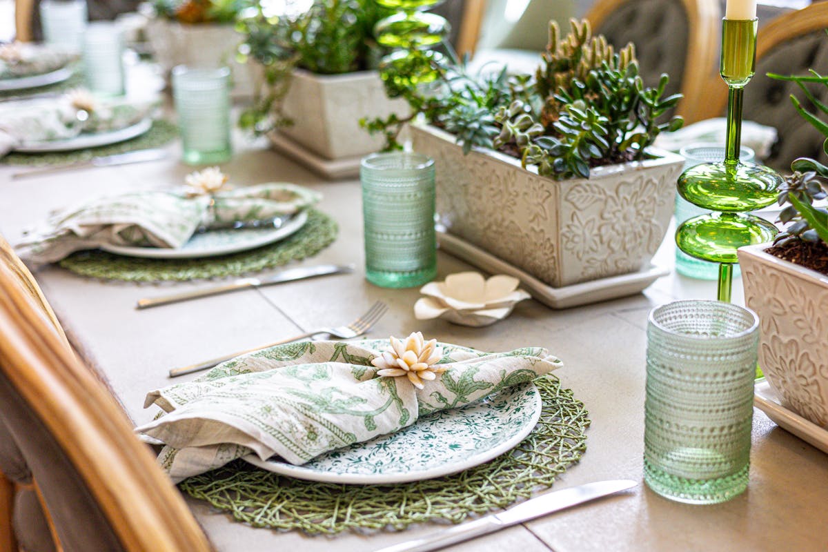 a table topped with a sandwich and a salad
