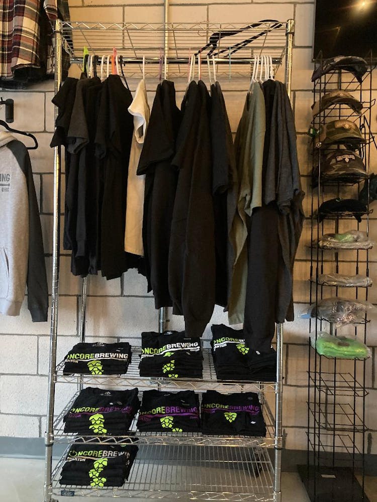 a bunch of clothes hanging on a wall
