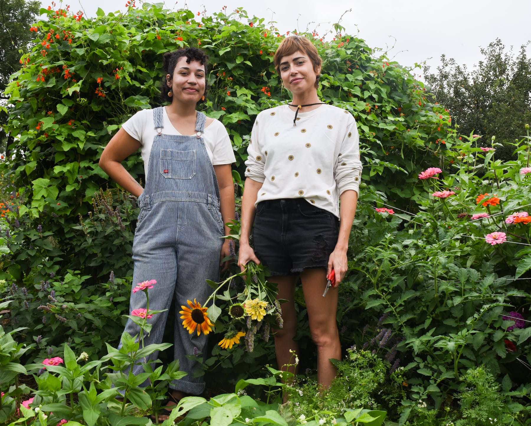a group of people standing in a garden