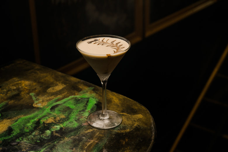 a close up of a wine glass sitting on a table