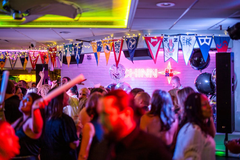 a group of people standing on a stage in front of a crowd