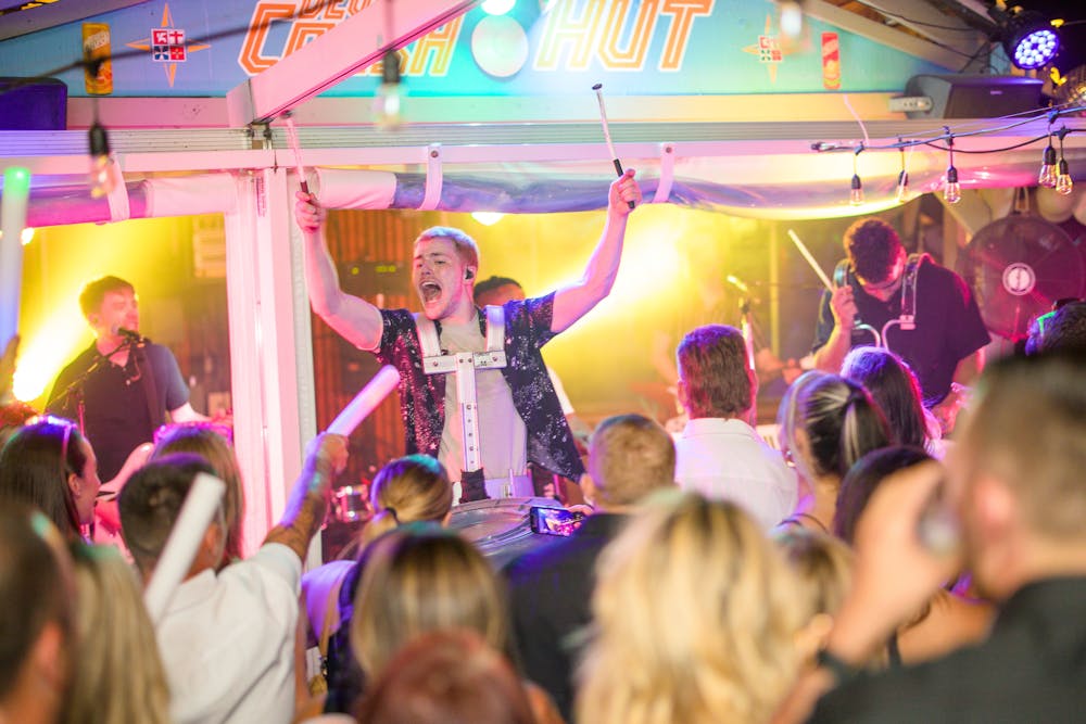 a group of people on a stage in front of a crowd