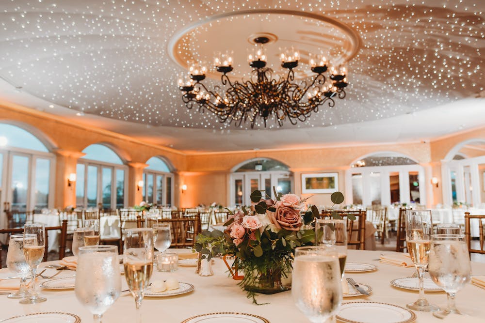 a group of people sitting at a table with wine glasses