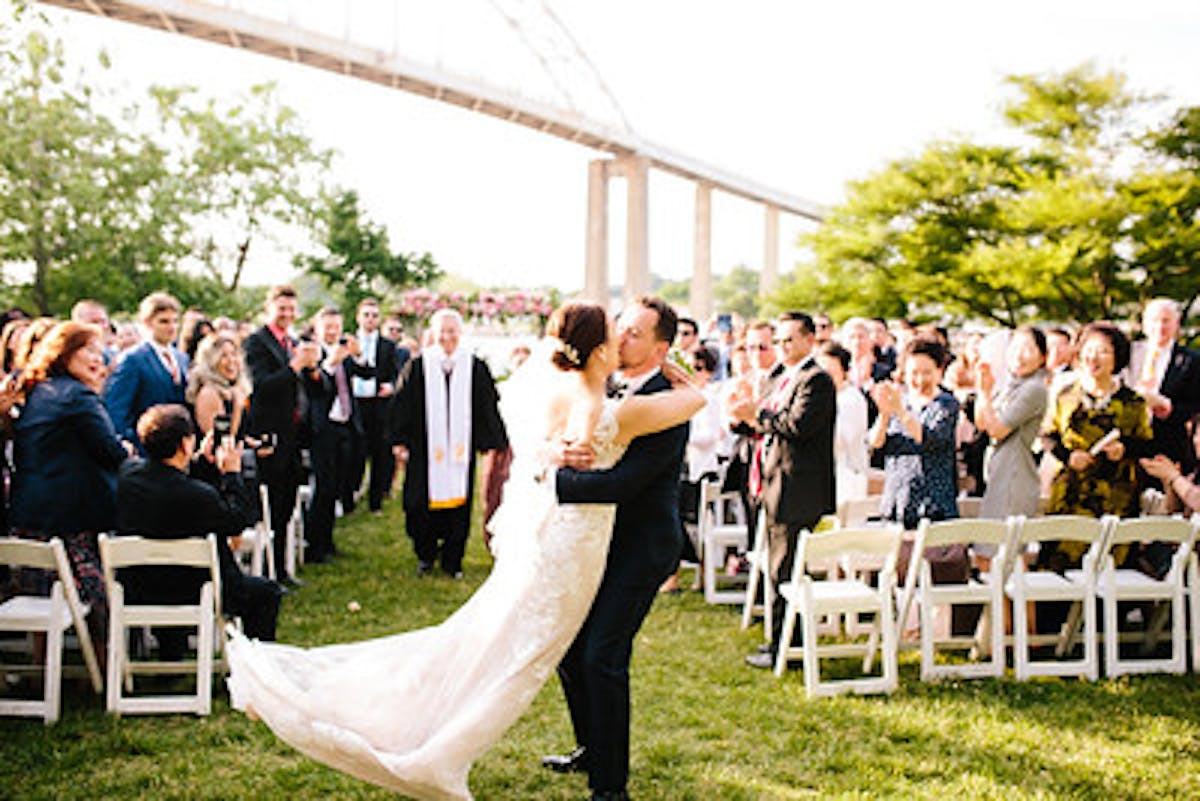 Couple and their guests enjoying perfect waterfront wedding