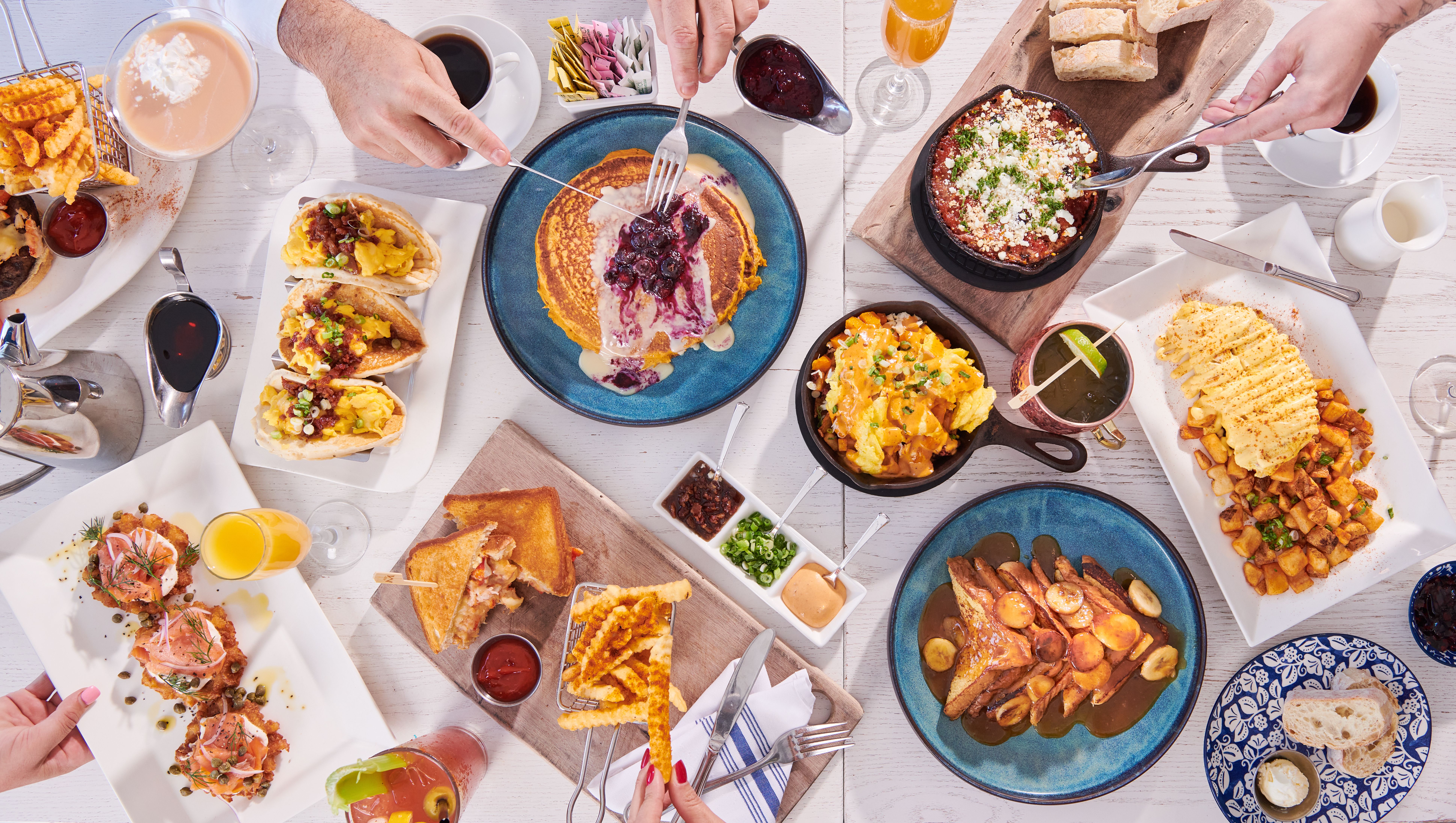 a bunch of different types of food on a table
