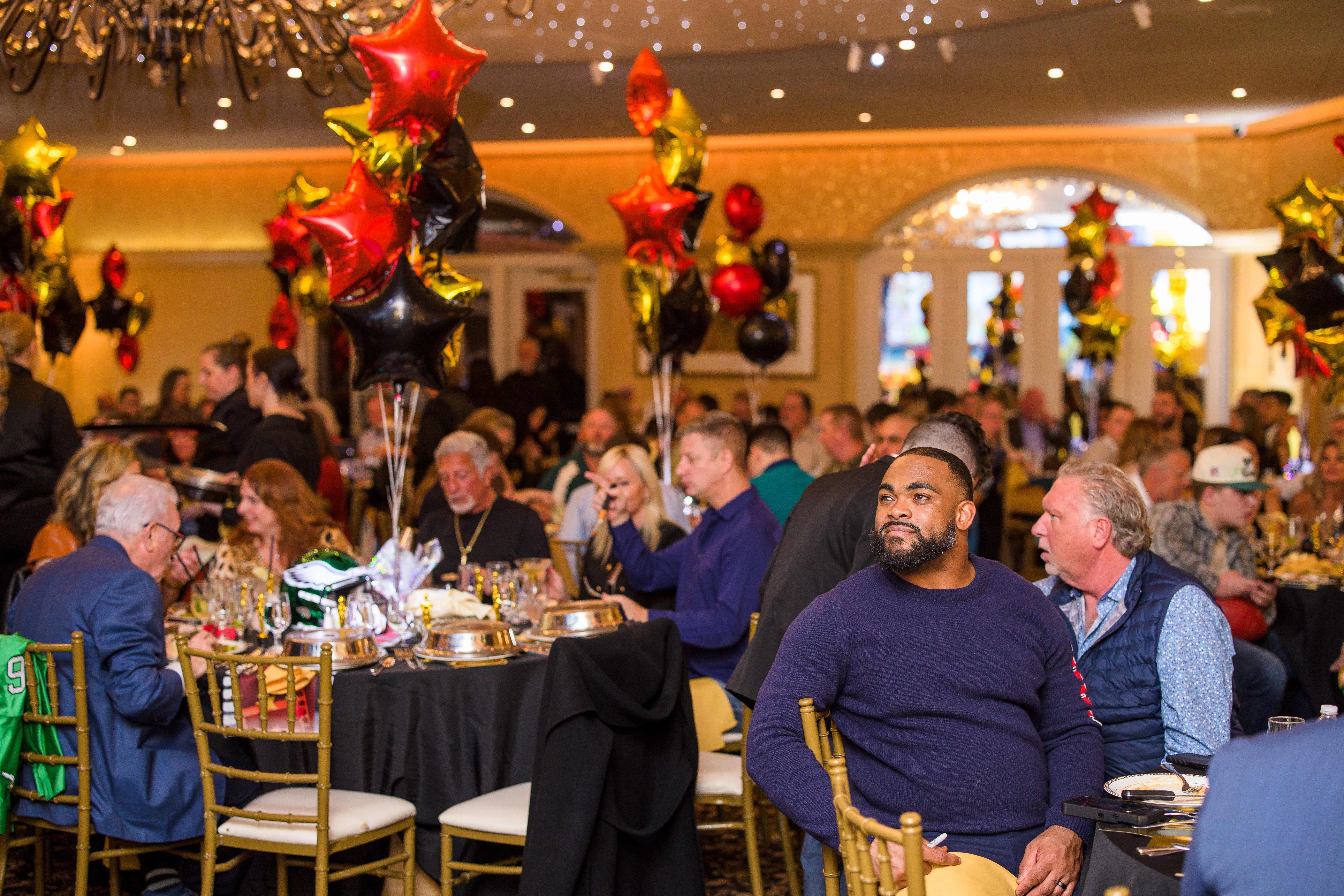 Brandon Graham et al. sitting at a table in a restaurant