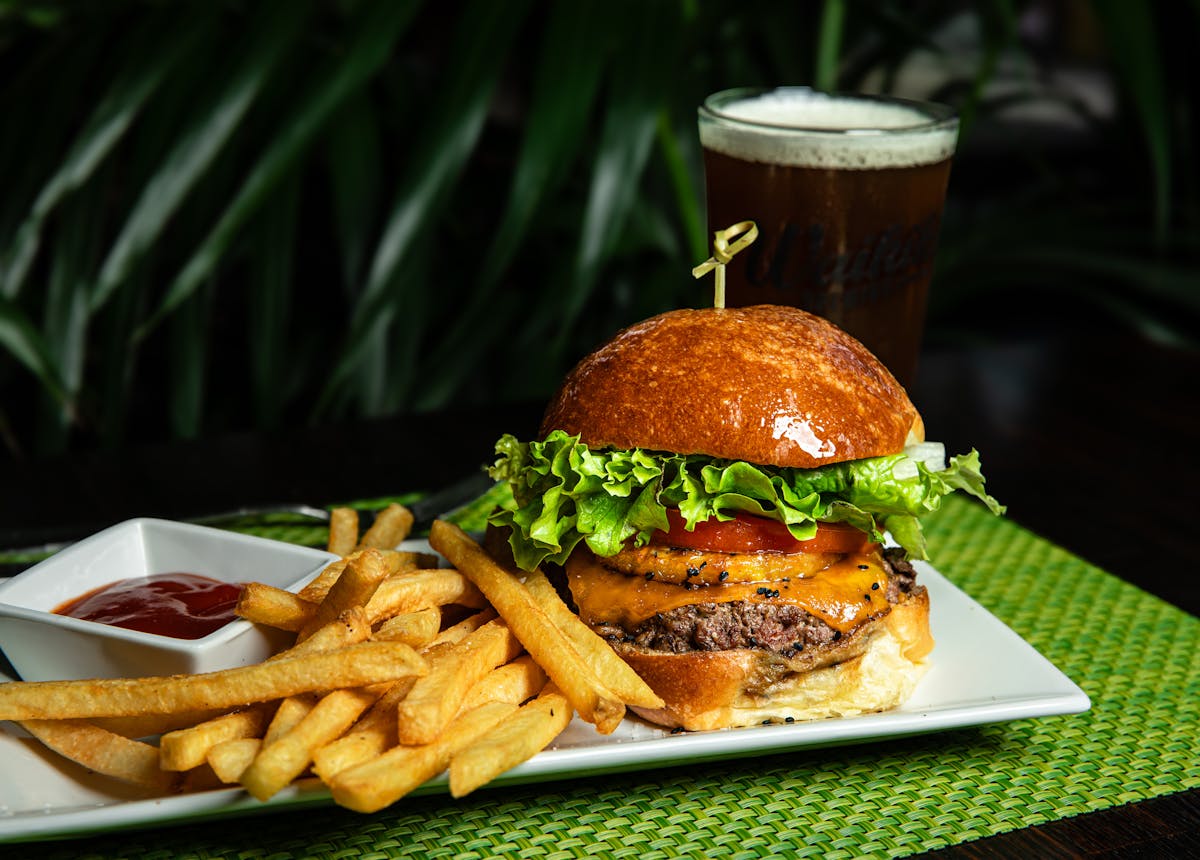 a sandwich with lettuce and fries on a plate
