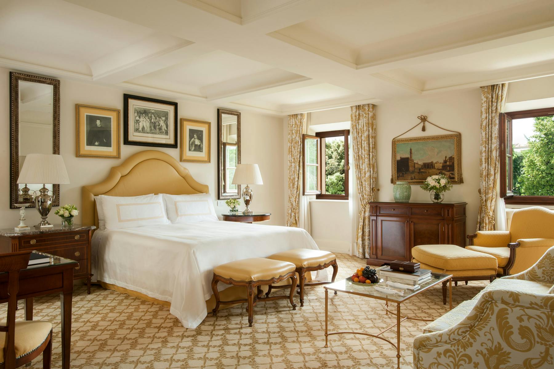 a bedroom with a bed and a chair in a room