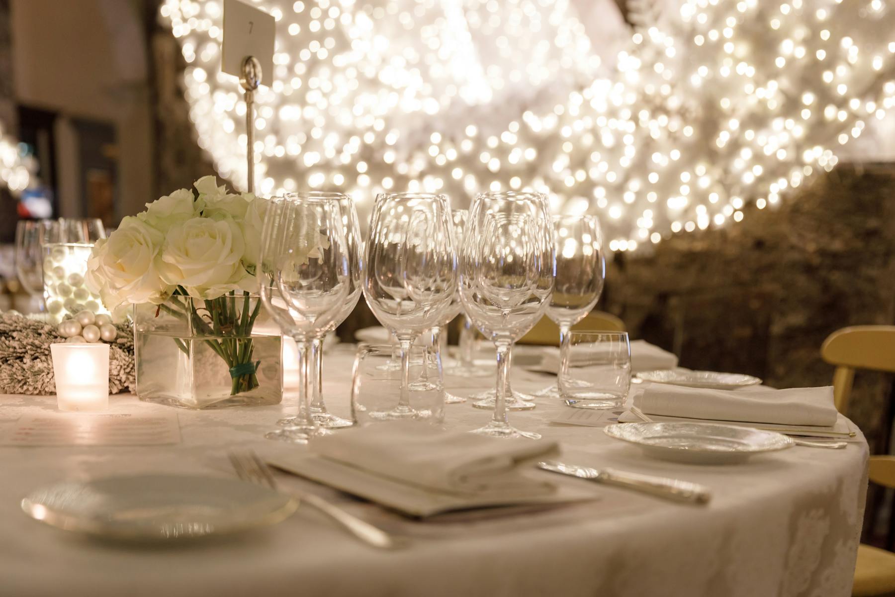 a dining table filled with wine glasses