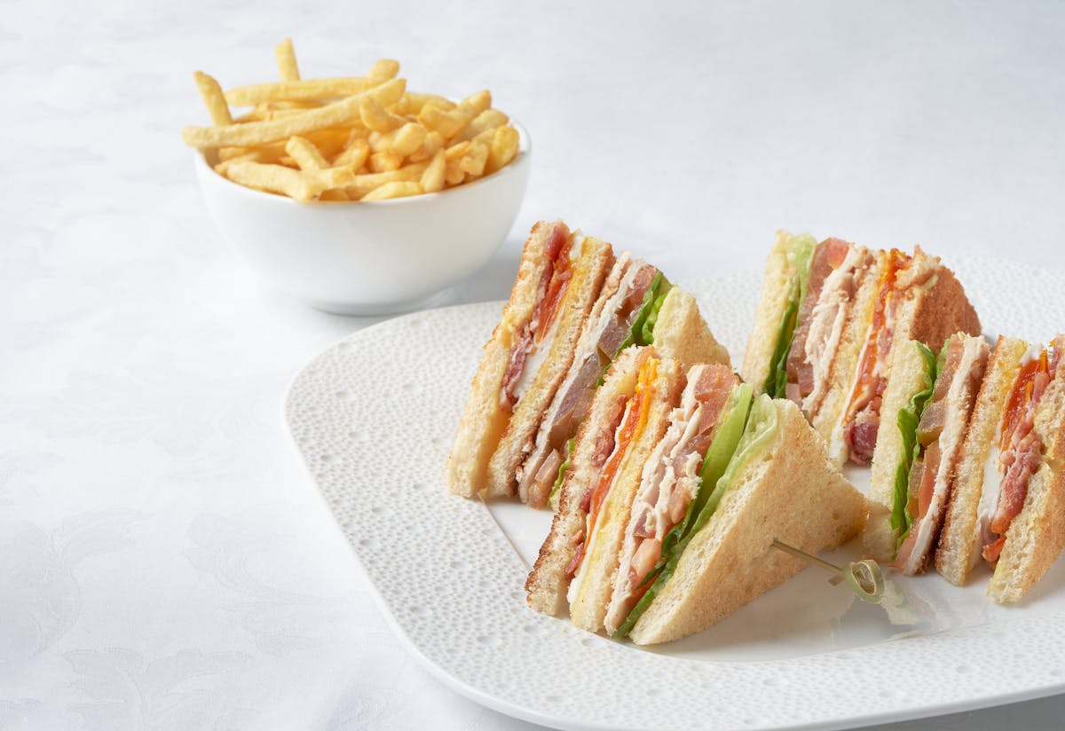 a sandwich and fries on a plate