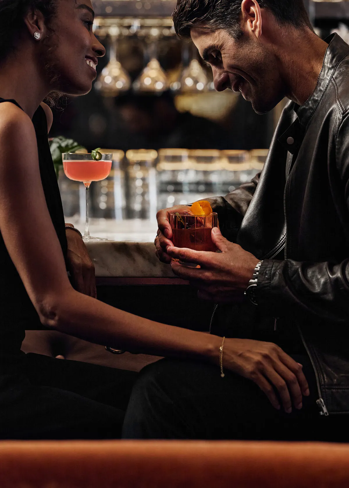 a man and a woman looking at the camera