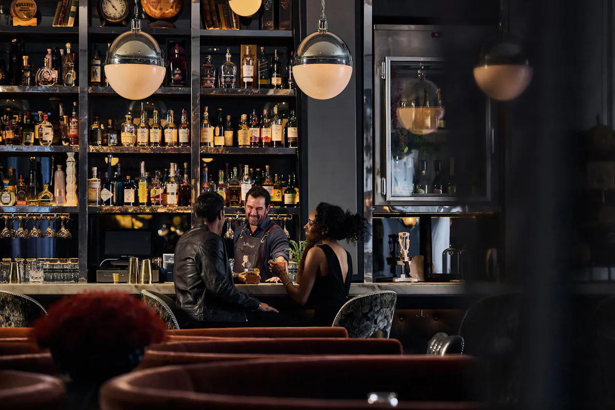 a group of people sitting at a table in a restaurant