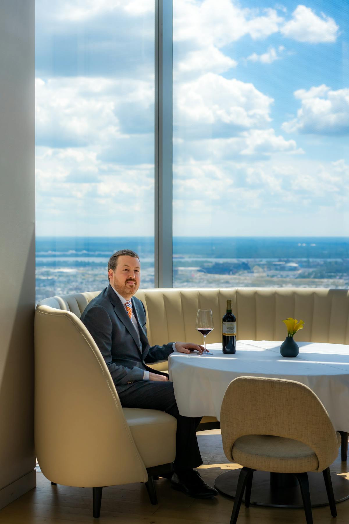 a person sitting on a chair in front of a body of water