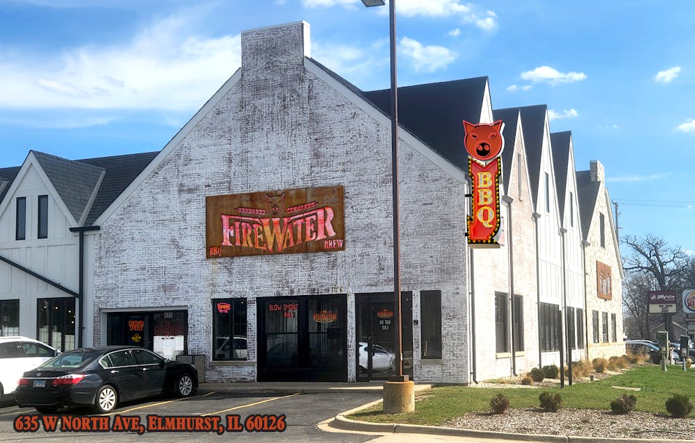 a sign in front of a brick building