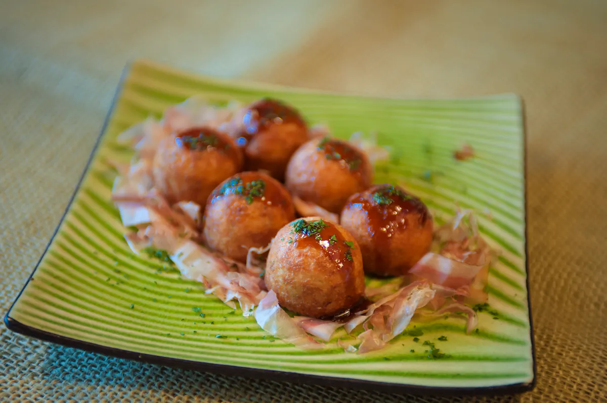 a plate of food sitting on top of a wooden table