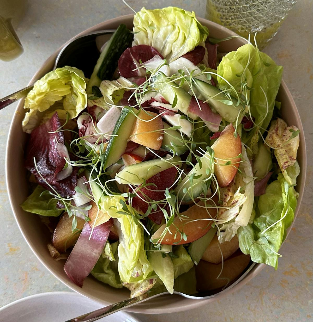 a bowl of salad on a plate