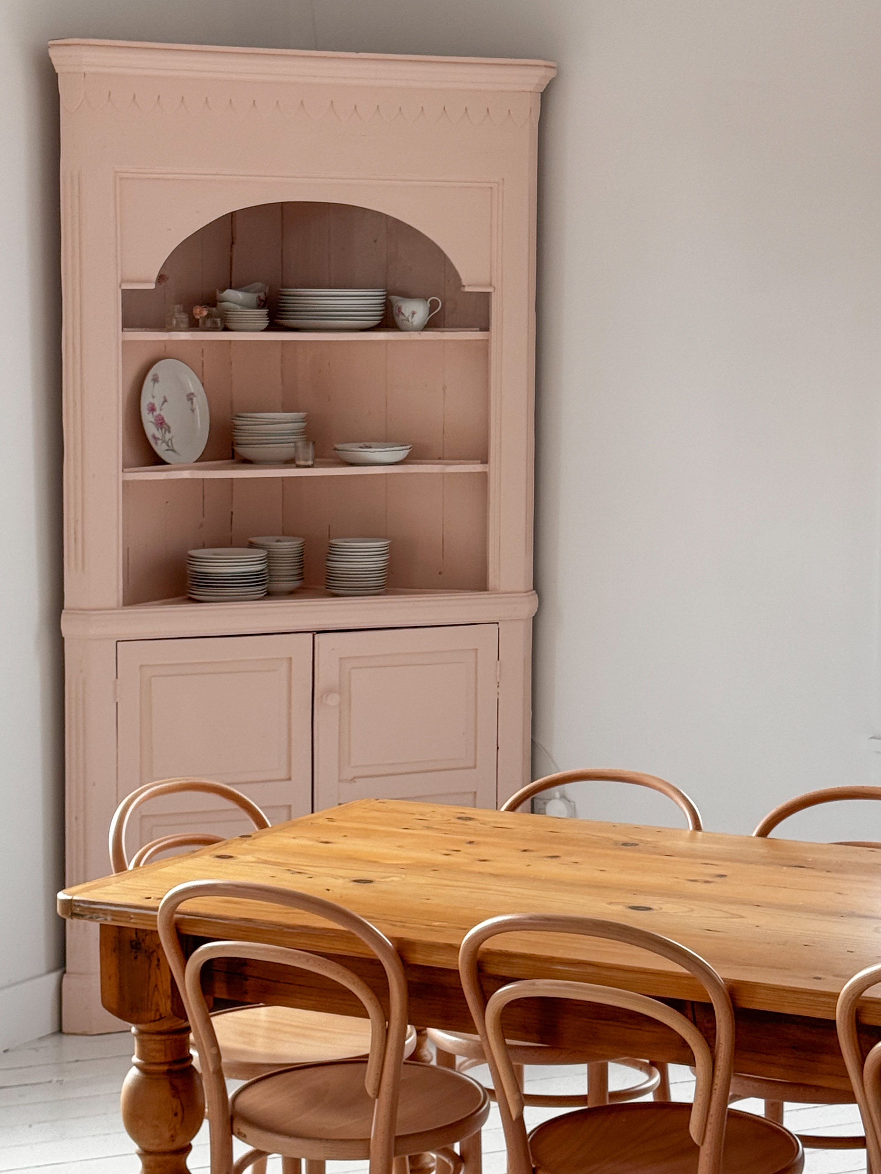 a chair sitting in front of a wooden table