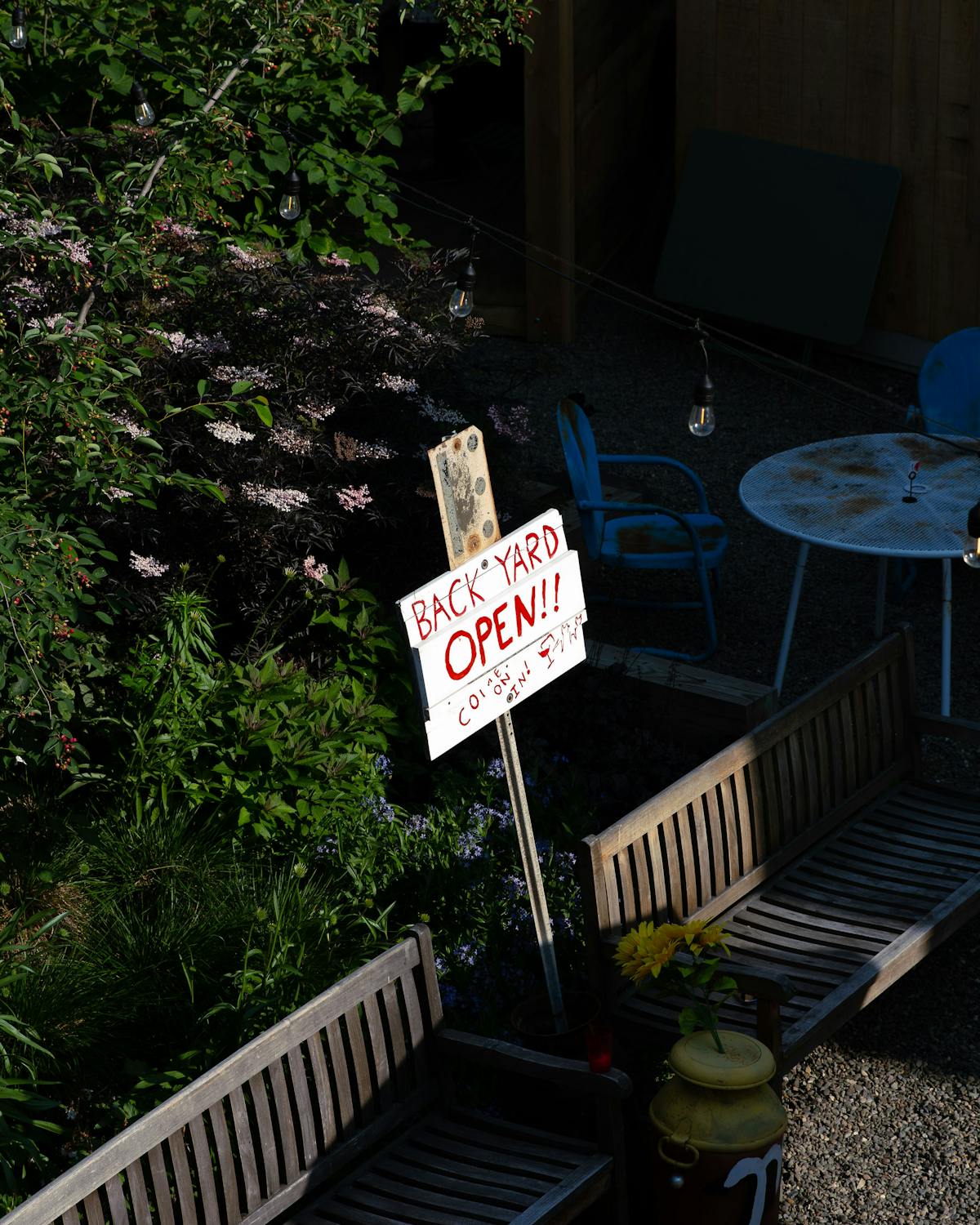 a sign on a wooden bench