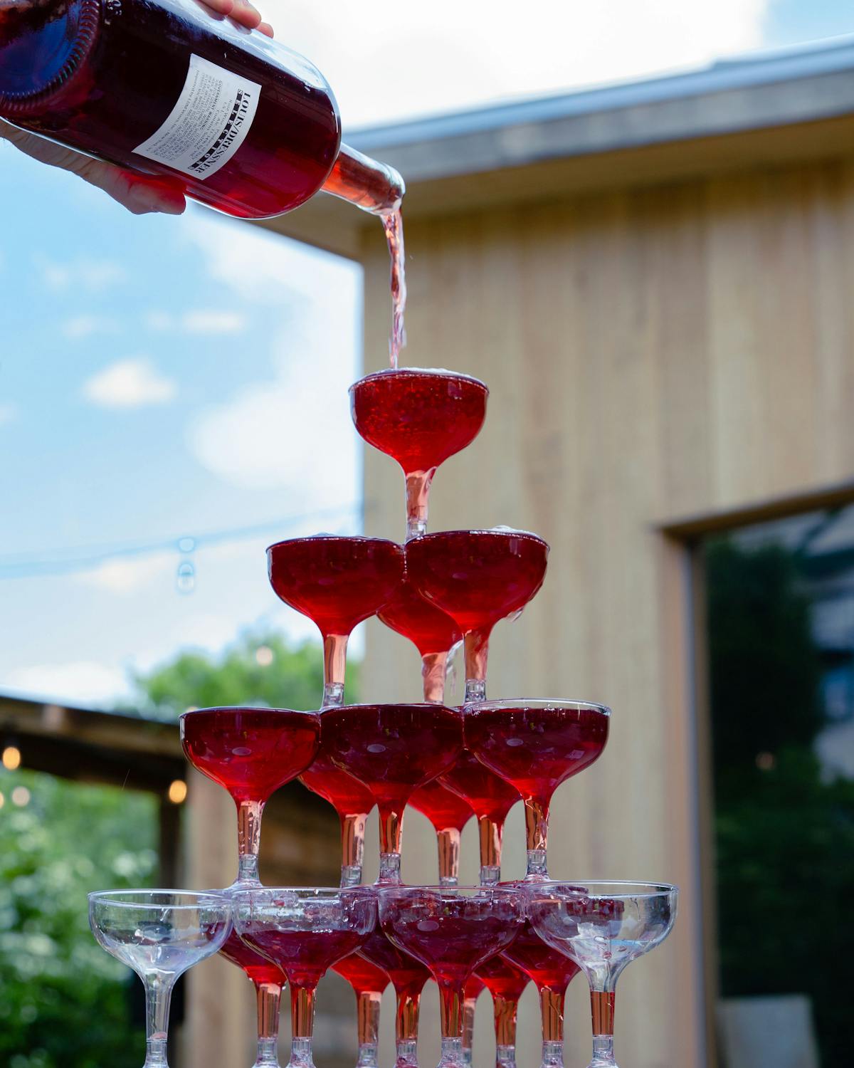 a group of people sitting at a table with wine glasses