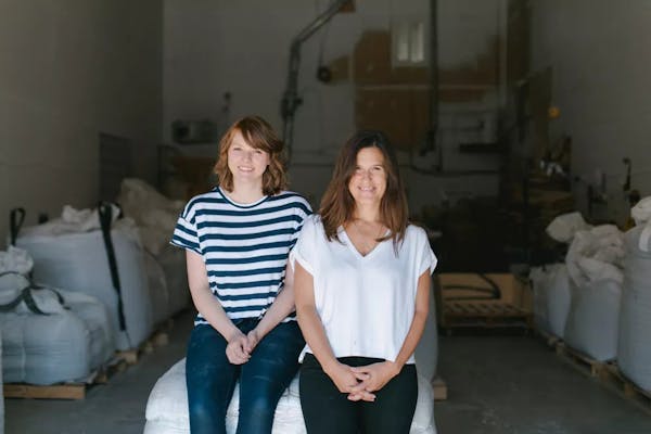 Two women sitting next to each other
