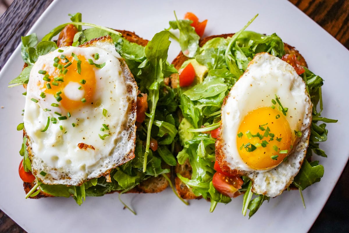 a plate of food with a sandwich and a salad