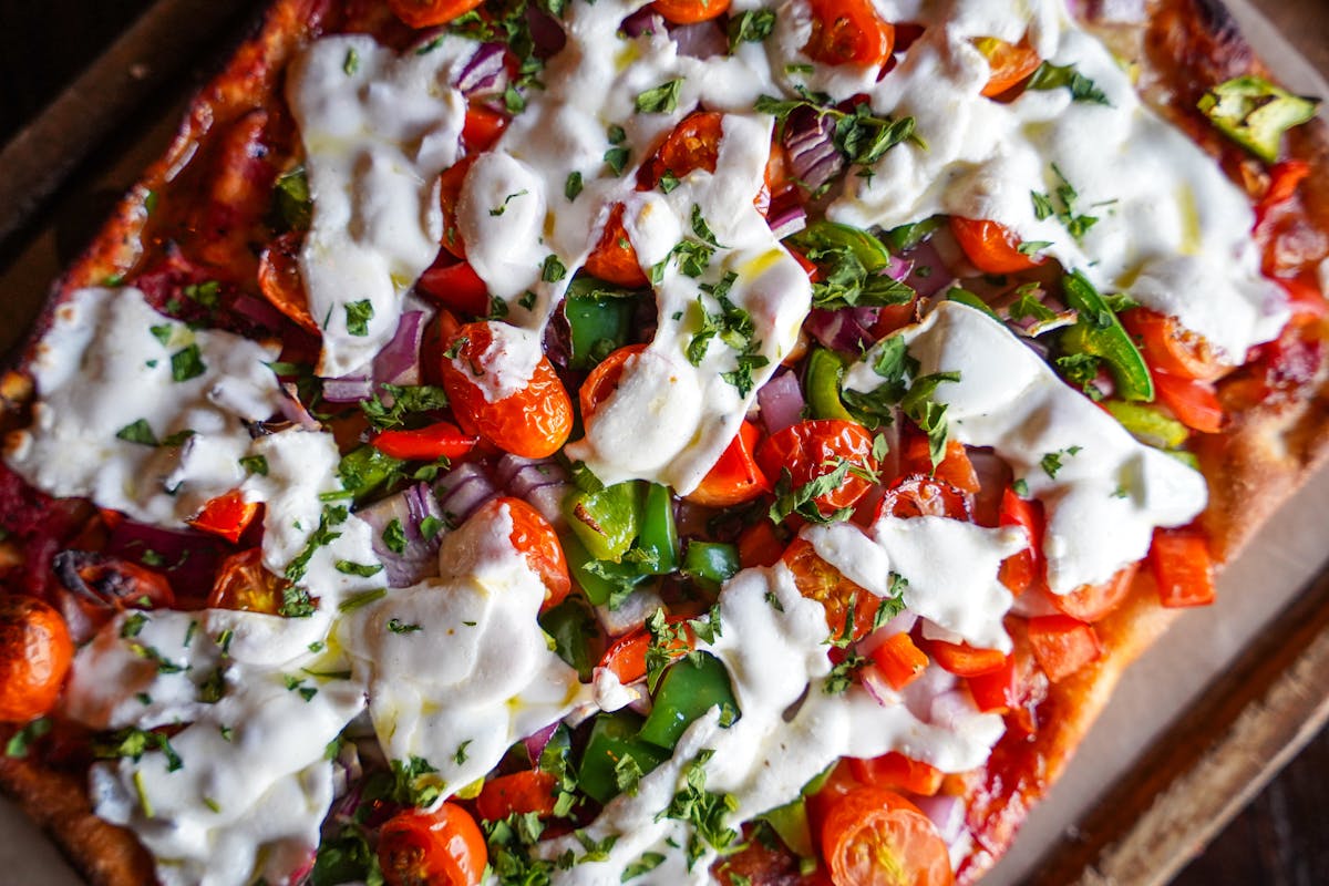 a close up of a slice of pizza