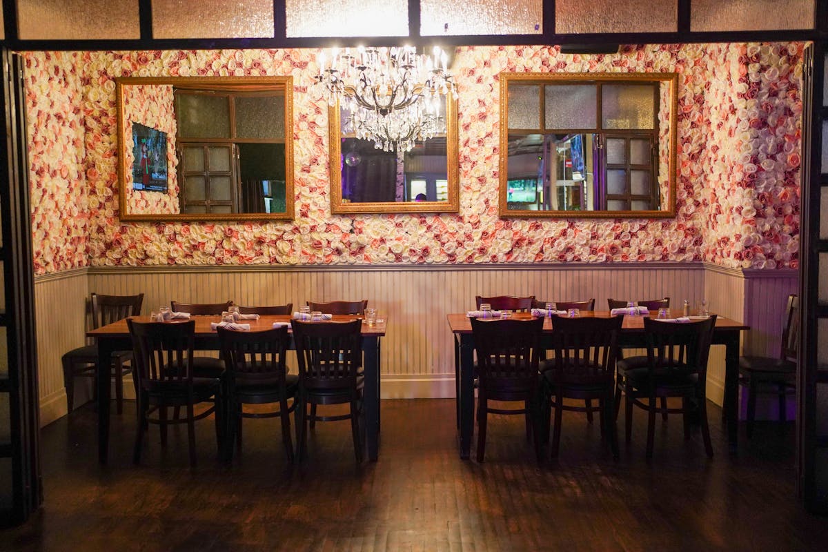 a dining room table in front of a window