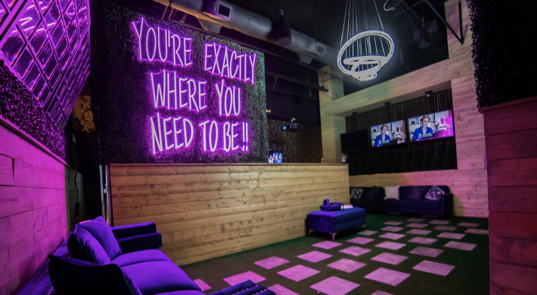 a purple sign above a store