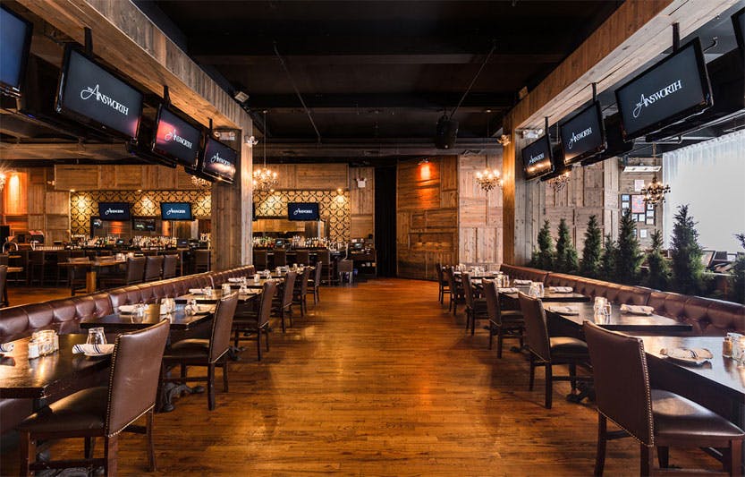 a room filled with furniture and a table in a restaurant