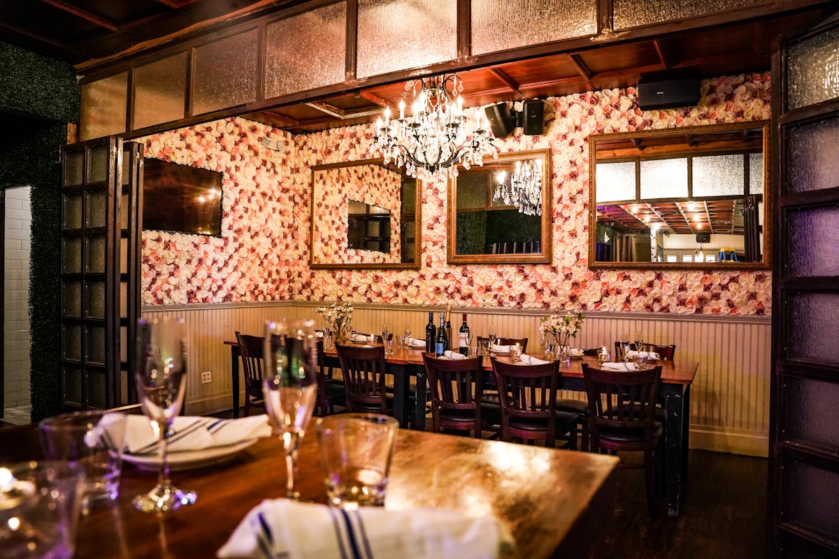 a room filled with furniture and a fire place and a dining table