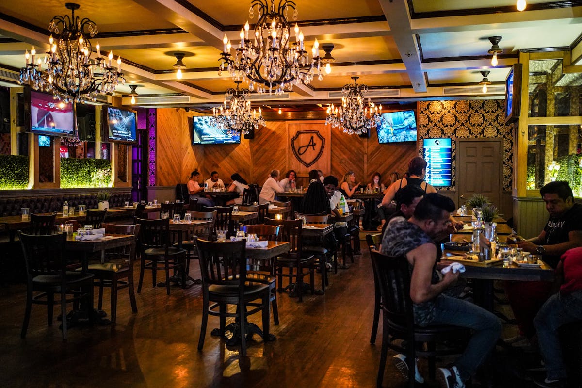 a group of people sitting at a table in a restaurant