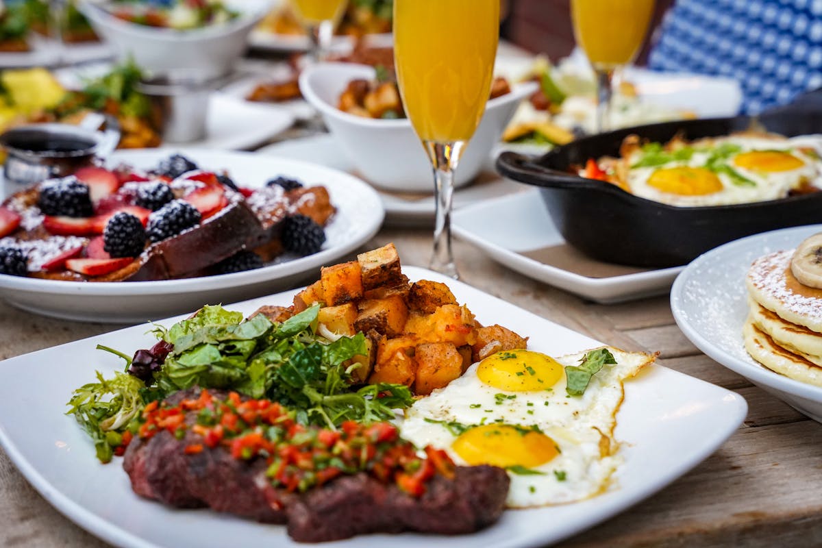 a table topped with plates of food on a plate