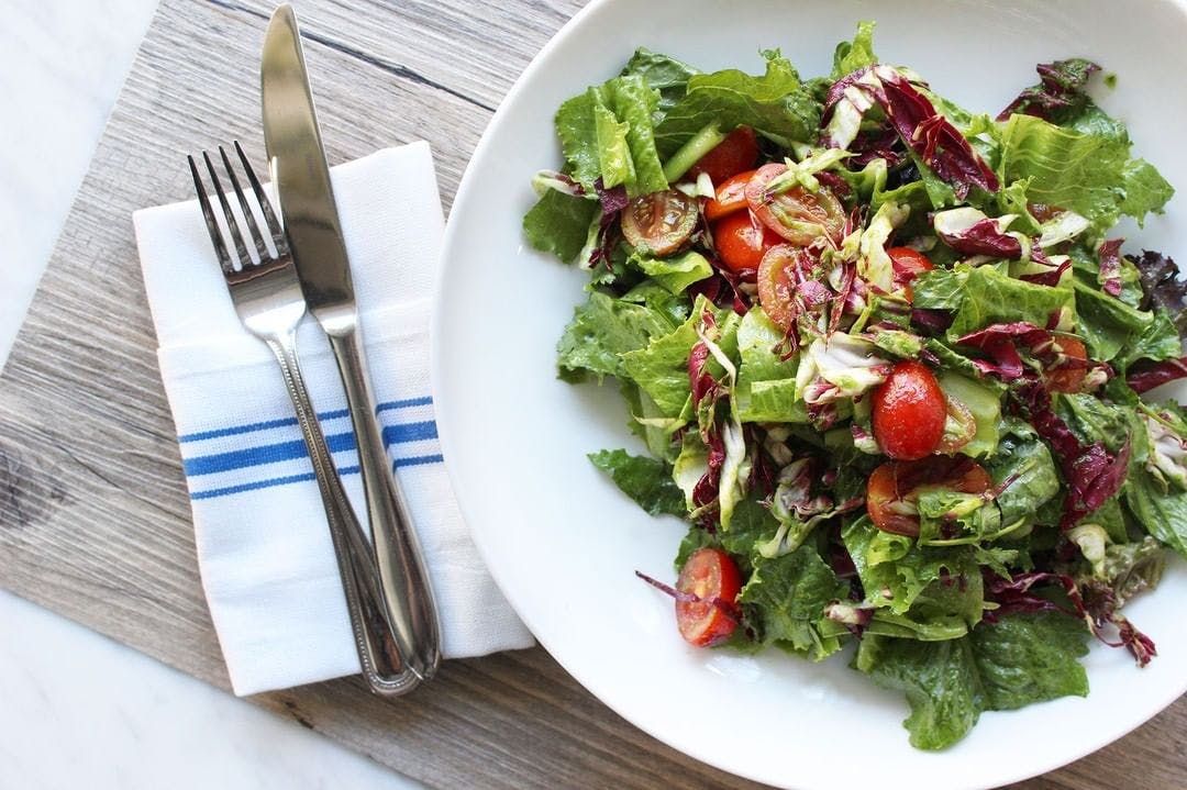 a plate of salad on a table