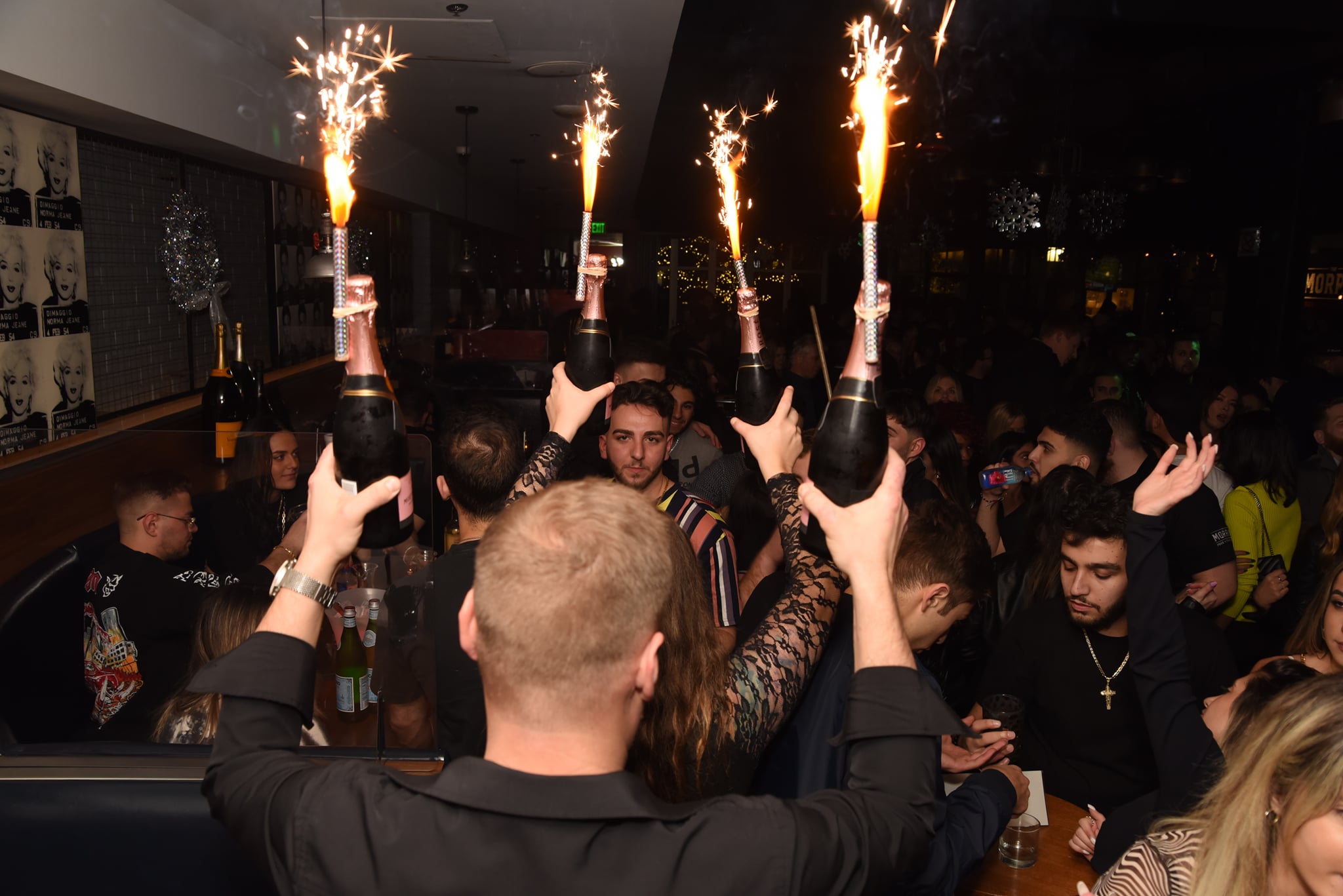 people holding champagne