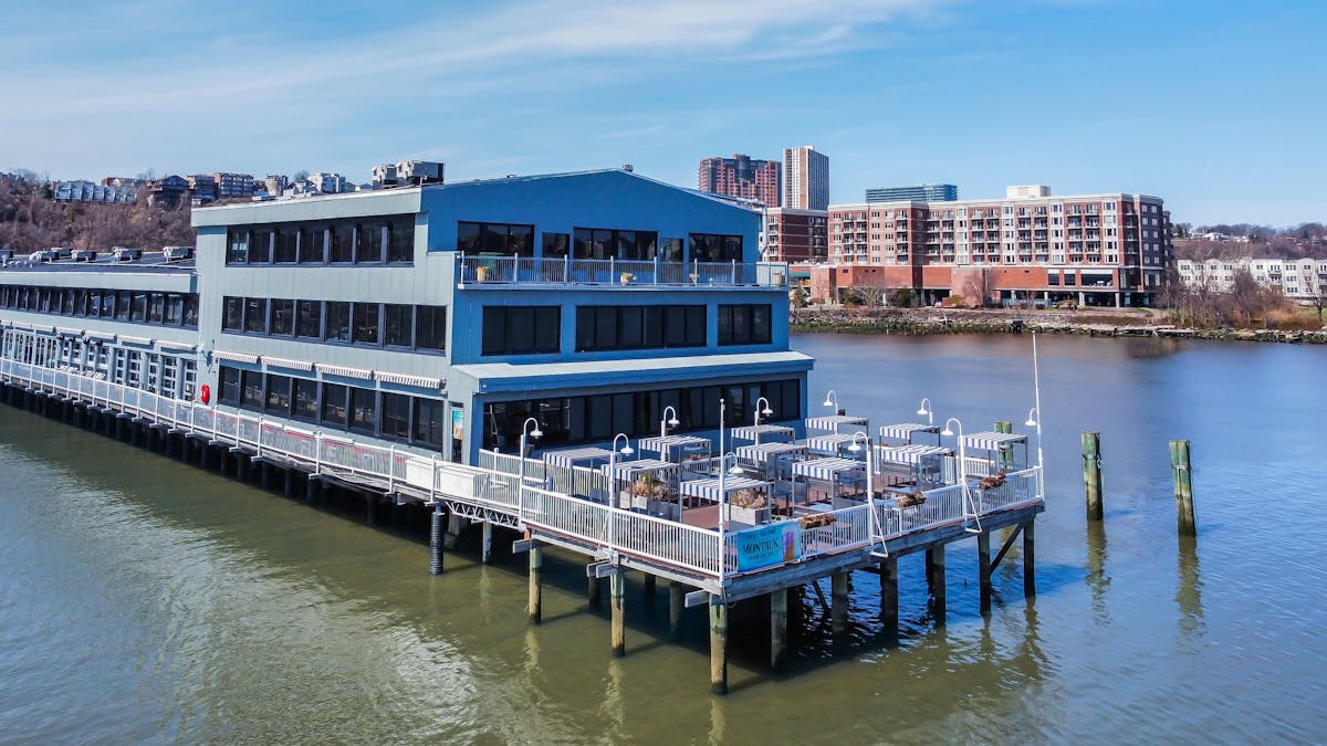 a boat is docked next to a body of water