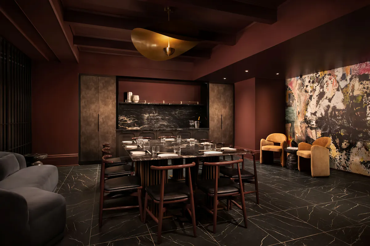 a room with a table and chairs