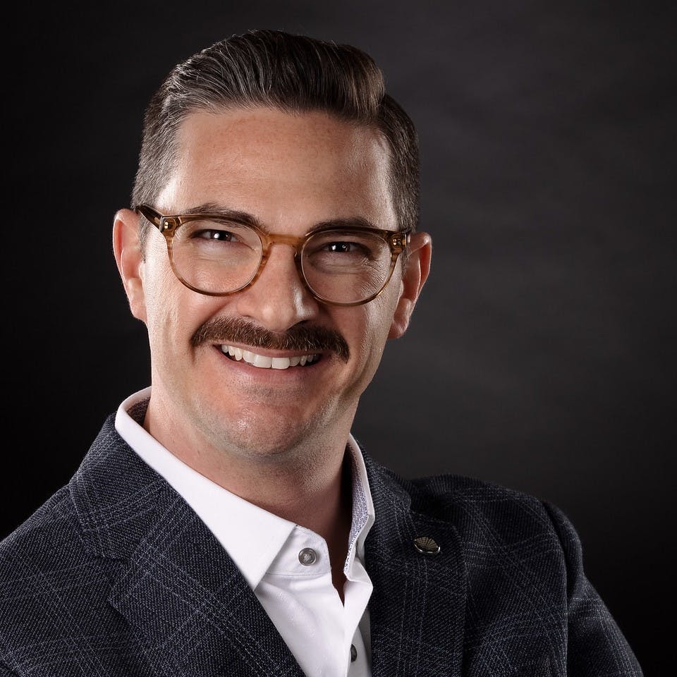 a man wearing a suit and tie