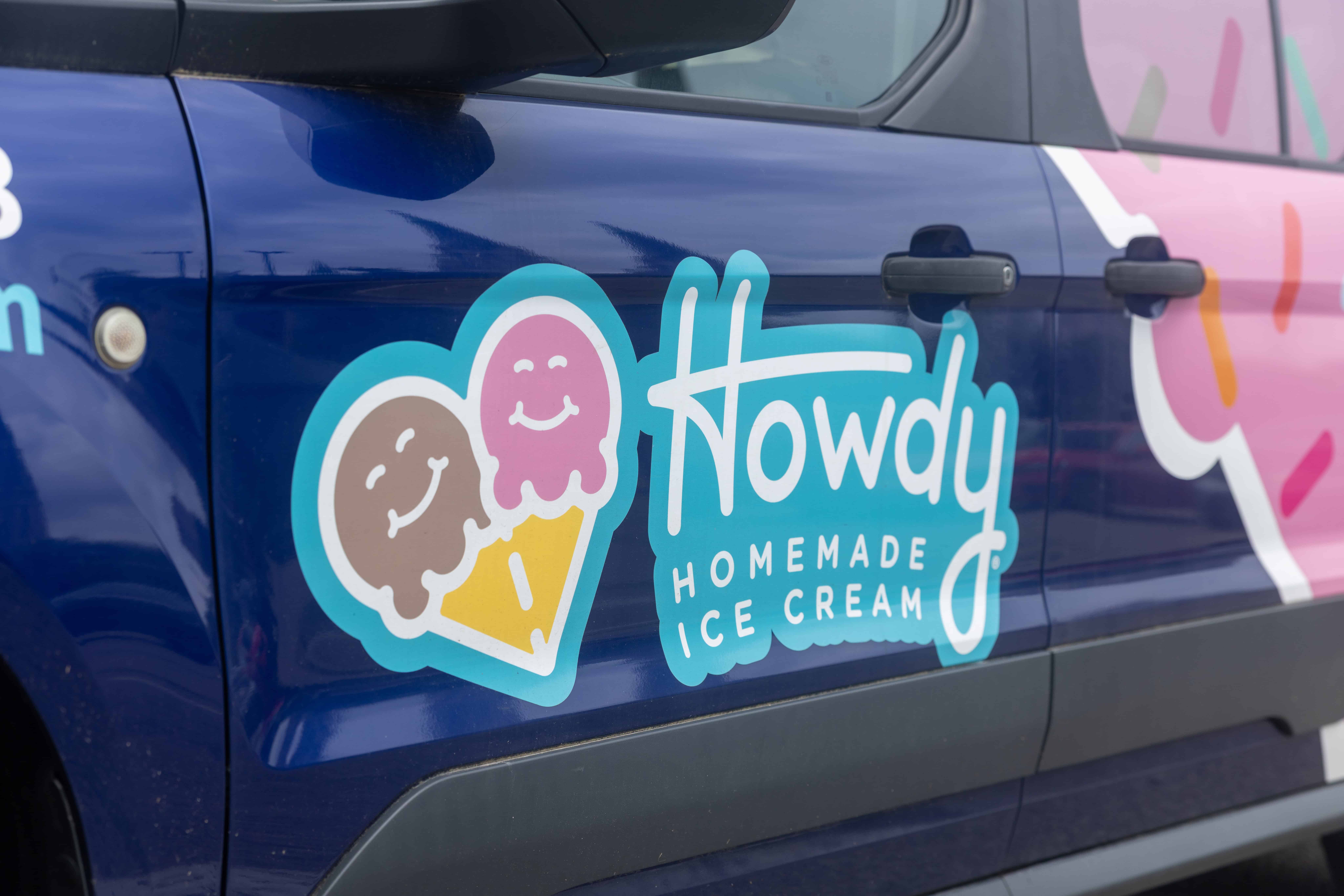 a van parked in front of a blue car