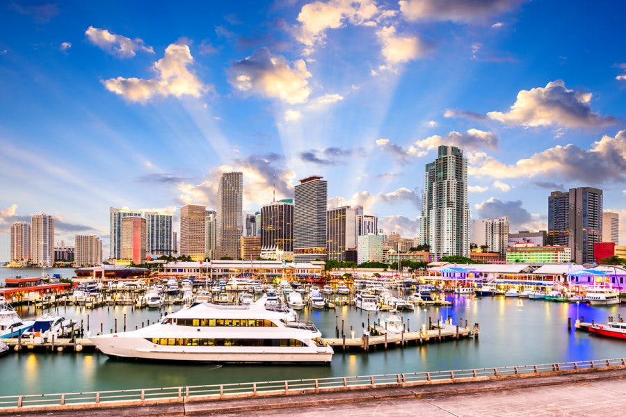 a large body of water with a city in the background