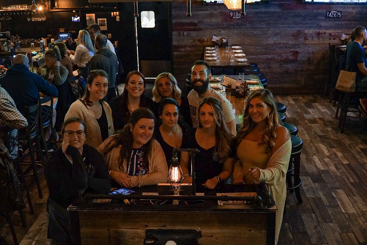 a group of people sitting posing for the camera