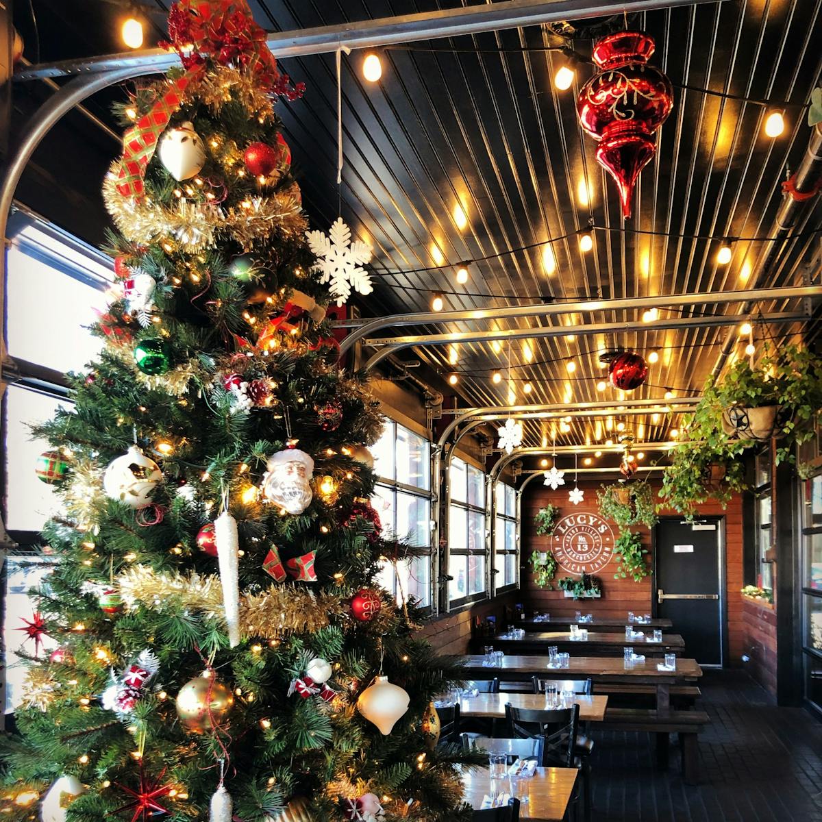 a dining room with a Christmas tree